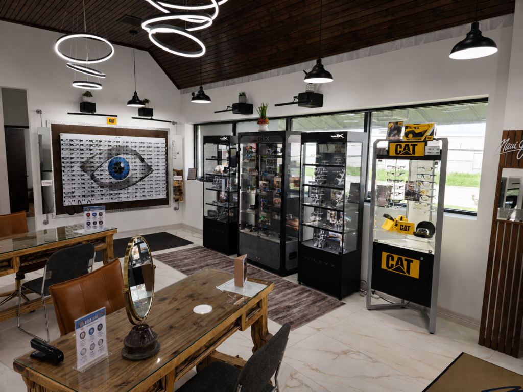 Inside the Safety Rx retail office with a frame display wall and branded eyewear cases